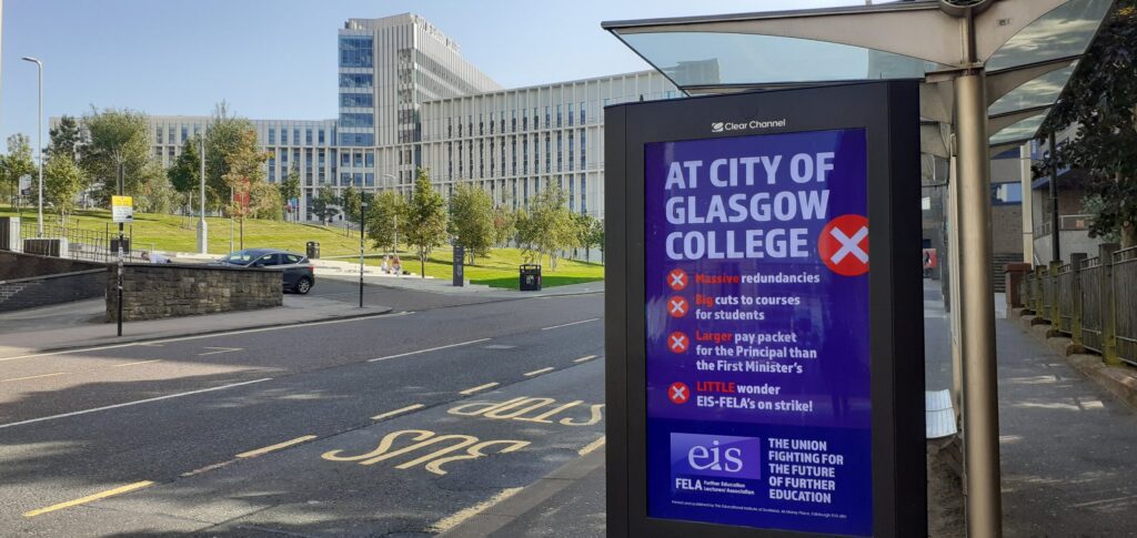 Bus shelter advertising board outside of City of Glasgow College reads: "Massive redundancies. Big cuts to courses for students. Larger pay packet for the Principal than the First Minister's. Little wonder EIS-FELA is on strike!"