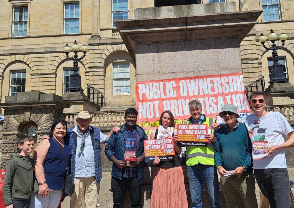 SSP members in Edinburgh campaigning against privatisation and PFI robbery. Placards and a banner all read "public ownership, not privatisation".